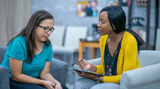 Teen using therapy worksheet to express emotions.